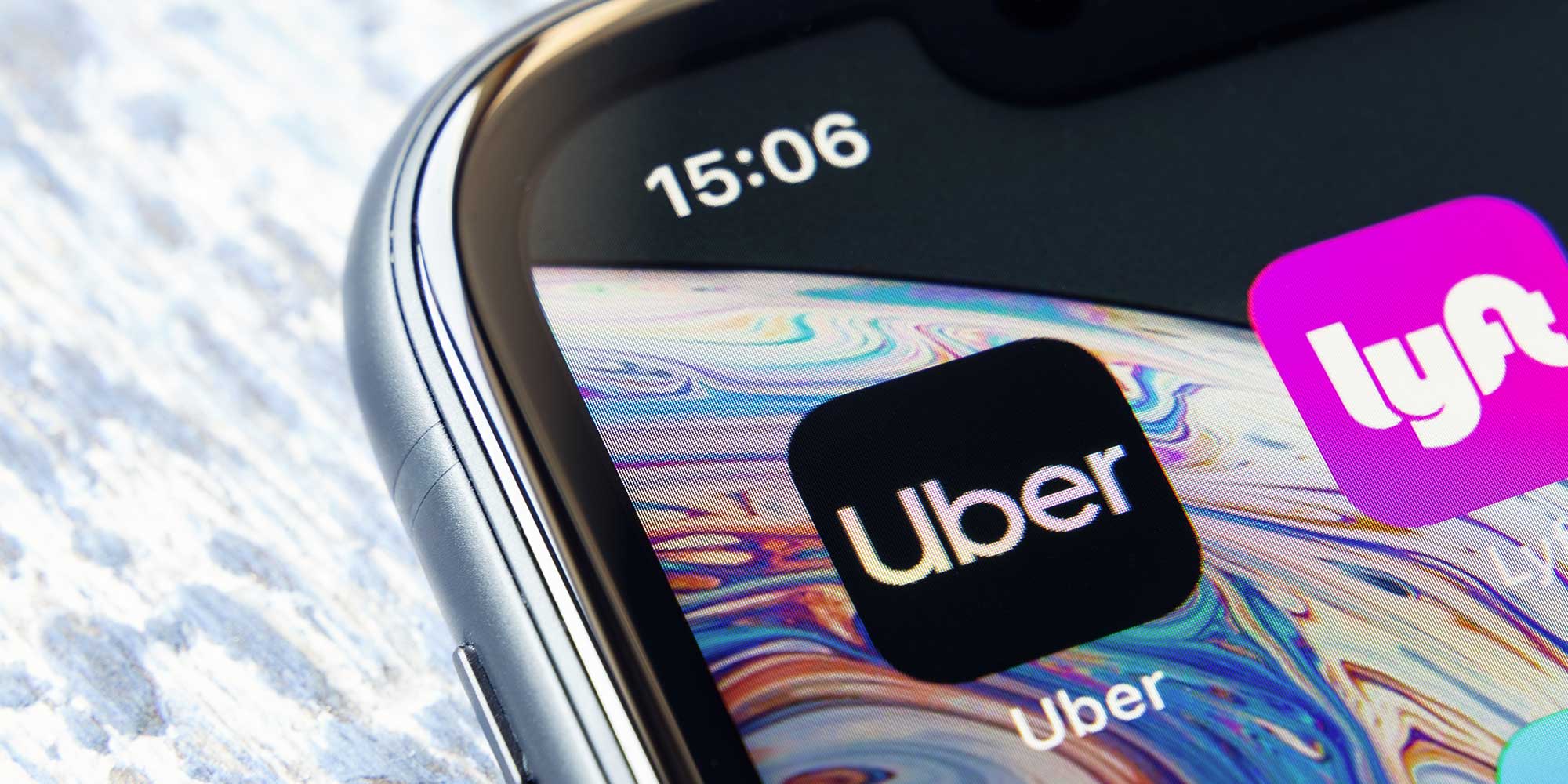 Rubenstein Law Personal Injury Lawyers 3 uber lyft icons on phone